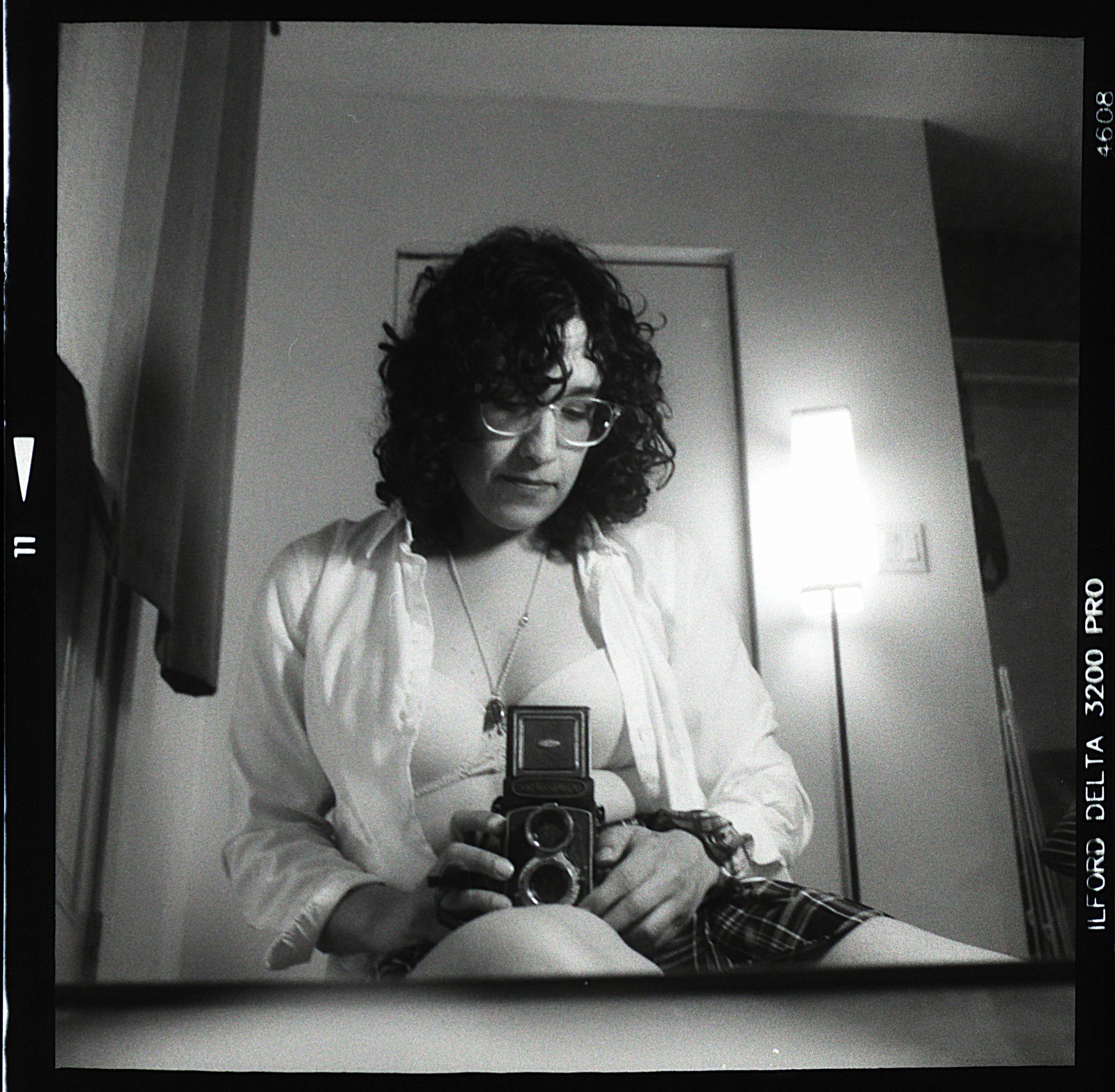 Self-portrait holding the camera, partially hidden